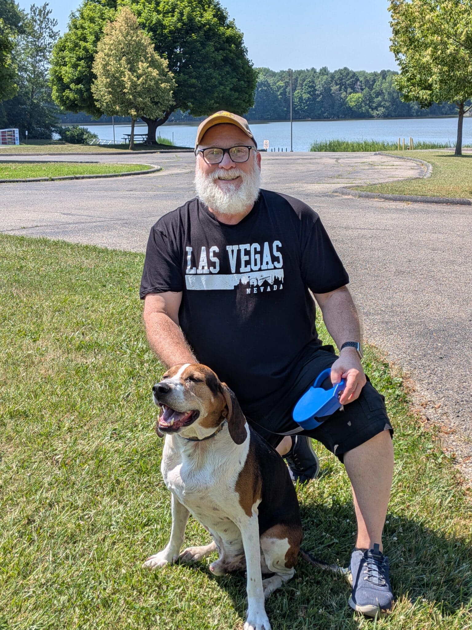 David Ritter with his dog Sonny beside the water.